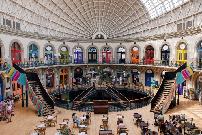 The interior of a Victorian rotunda, with a high, curving ceiling and multi-coloured doors set in alcoves