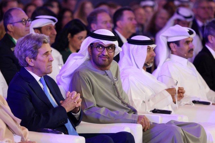 UAE minister of state and CEO of the Abu Dhabi National Oil Company, Sultan Ahmed al-Jaber (2-L) and US climate envoy John Kerry at the Atlantic Council Global Energy Forum in Abu Dhabi in January