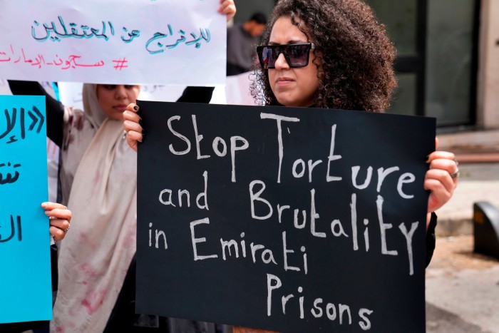 A woman in Lebanon campaigns this week against the detention of Lebanese citizens in the UAE, outside the foreign ministry headquarters in Beirut