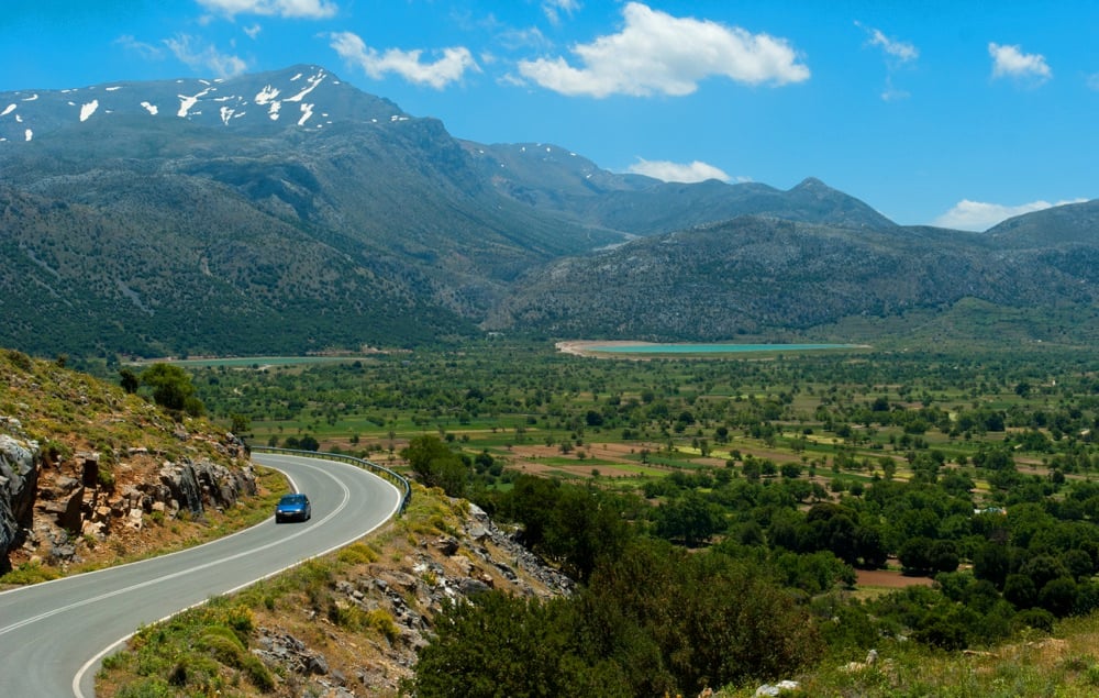 Road winding through the farms and mountains of the Lasithi Plateau, Crete