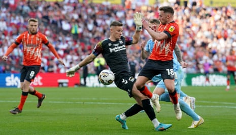 Luton Town's Jordan Clark goes to ground after a challenge by Coventry City goalkeeper Ben Wilson, resulting in a yellow card for simulation during the Sky Bet Championship play-off final at Wembley Stadium.