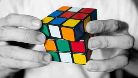 Montage image showing a person doing a Rubik’s Cube