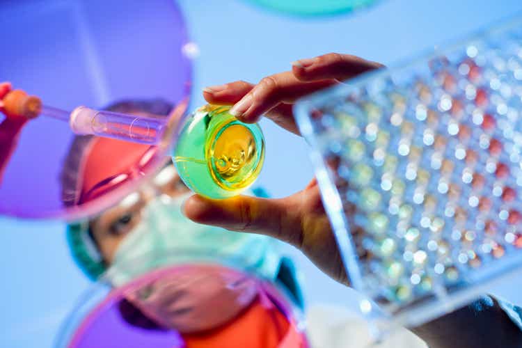 Technician at a laboratory surrounded by lab tools