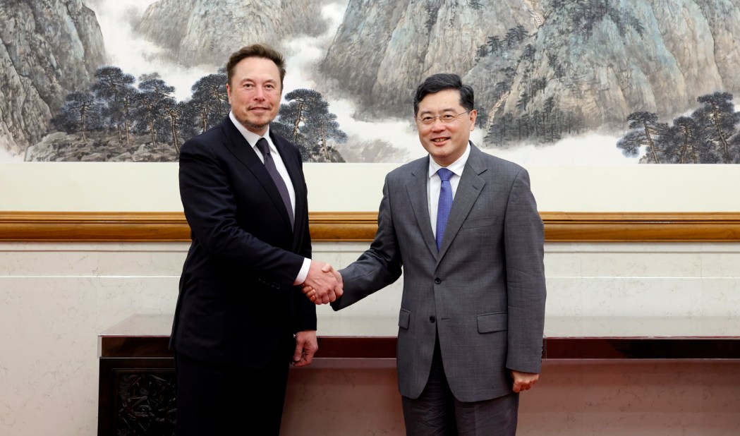 Elon Musk  shaking hands with China's Foreign Minister Qin Gang