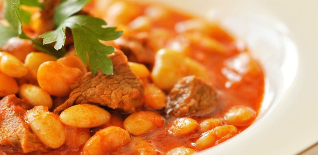 Turkish cuisine; Lamb and beans in tomato sauce and onions. 