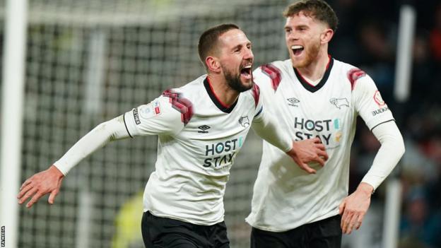 Conor Hourihane (left) celebrates his winning goal for Derby against Burton