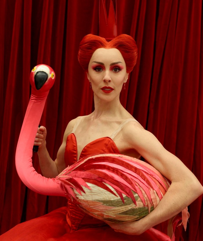 The Australian Ballet’s Amy Harris playing the Queen of Hearts and holding a puppet of a flamingo in ‘Alice’s Adventures in Wonderland’