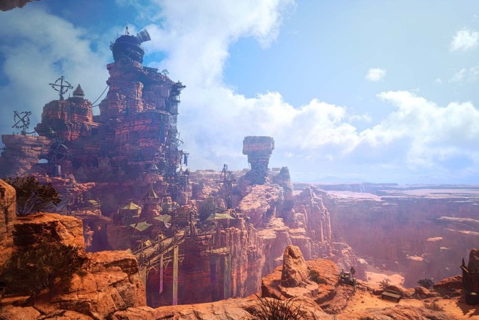 An image from a video game shows a spectacular landscape of promontories and outcrops, with dwellings and structures built into the rock