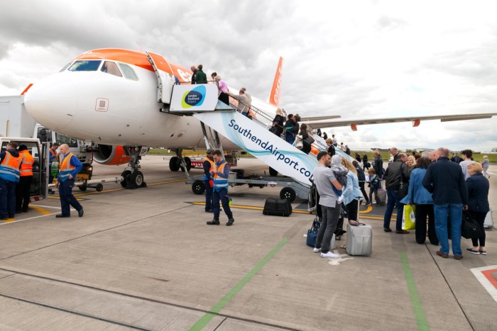Passengers at  Southend Airport board an Easyjet flight to Malaga