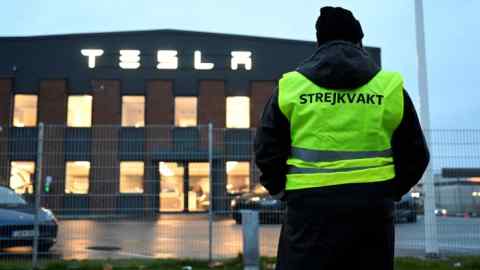 A worker strikes outside a Tesla centre in Segeltorp, Sweden. Foreign investors need to respect the rules and cultures of the countries where they seek to do business