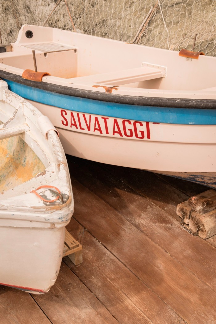Two small white boat, one with the word ‘Salvataggi’ on the side