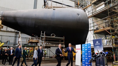 Britain&angst;fs Secretary of State for Defence Grant Shapps, center right, and Britain&angst;fs Foreign Secretary David Cameron, left, walk with the Premier of South Australia Peter Malinauskas, right, Deputy Prime Minister of Australia Richard Marles, second right, Australian Minister for Foreign Affairs Penny Wong, second left, and United States&angst;f Ambassador to Australia Caroline Kennedy, during a visit to the Osborne Naval Shipyard in Adelaide, Australia, Friday, March 22, 2024.