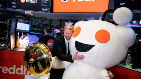 Steve Huffman, co-founder and chief executive officer of Reddit, with the company’s mascot on the floor of the New York Stock Exchange on Thursday