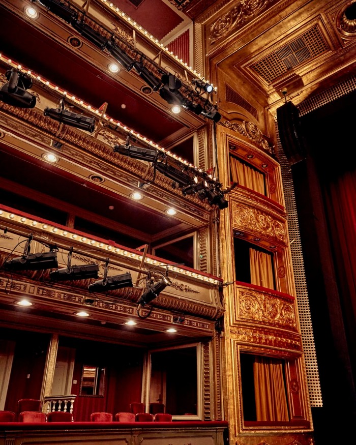 Dark-wood, gilt and red velvet stalls and boxes at one side of the auditorium of Madrid’s Teatro de la Zarzuela