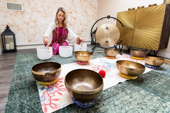 Svetlana Chebysheva playing the bowls during her sound bath at Notting Hill’s Cloud Twelve