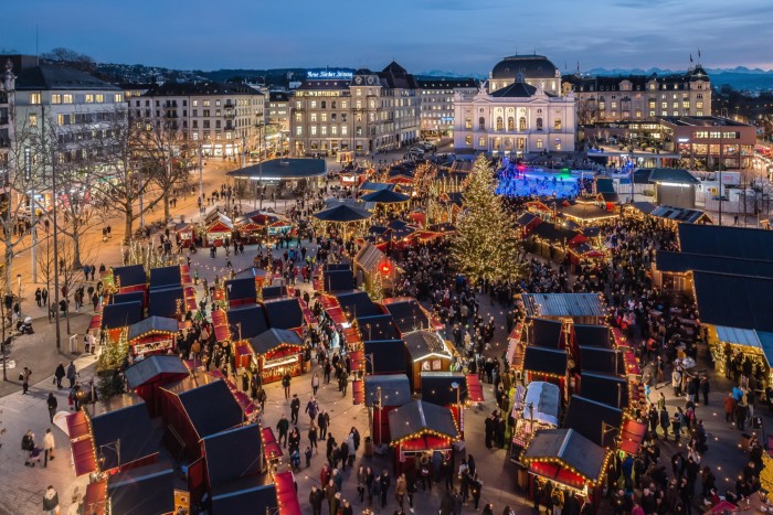 An aerial photograph of Zürich’s Christmas village at dusk