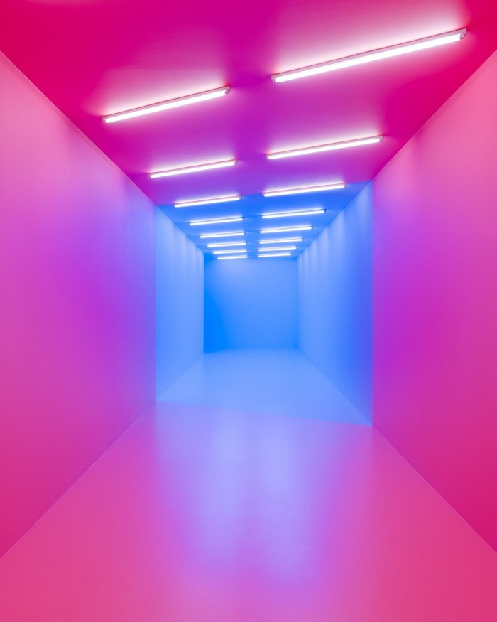 Kapani Kiwanga’s ‘pink-blue’ artwork: an installation of pink-painted floor, walls and ceiling, from which hang white and blue fluorescent lights 