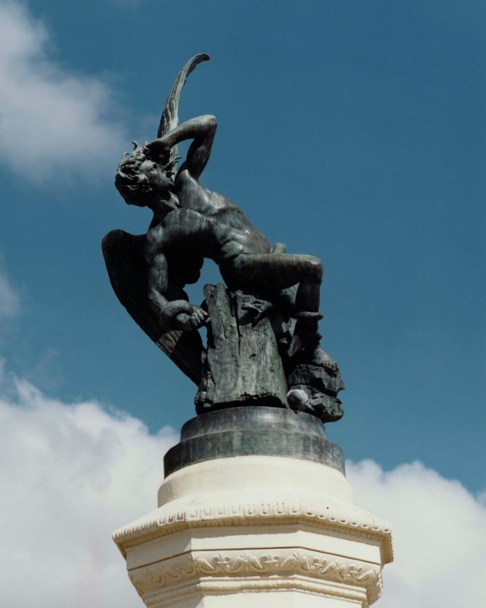 A statue of the fallen angel Lucifer on the Fuente del Ángel Caído