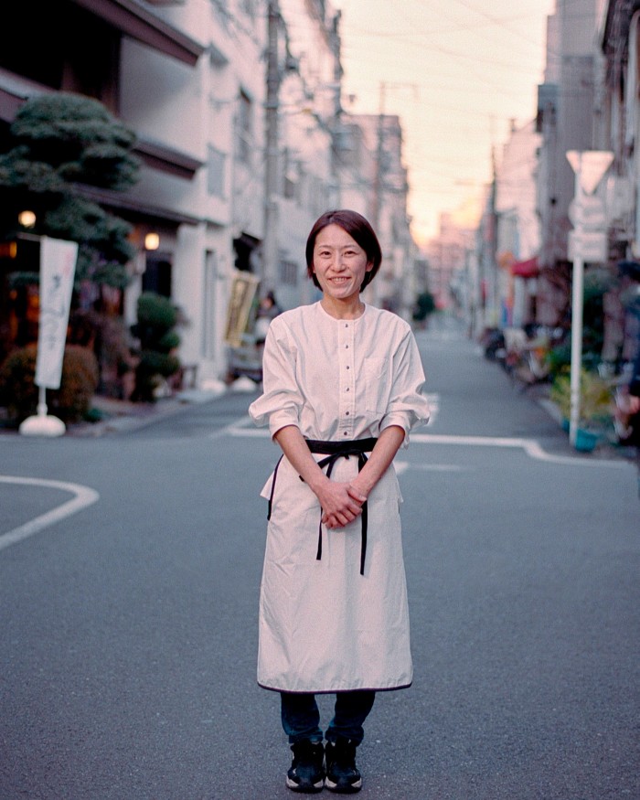 Chef Yuko Suzuki of Sushi Yuko standing in a Tokyo street