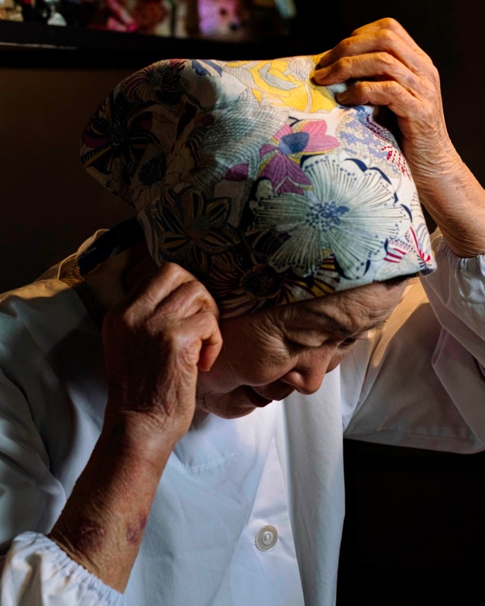 Chef Sachiko Shimizu adjusting her headscarf