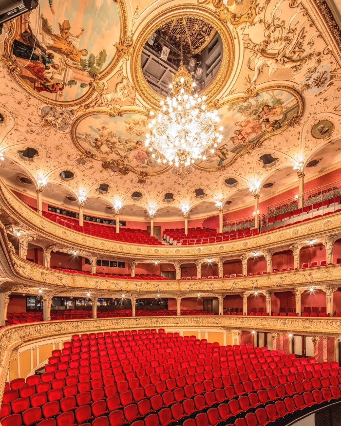 The ornate interior of the Zürich Opera House, with its Baroque-style painted ceiling