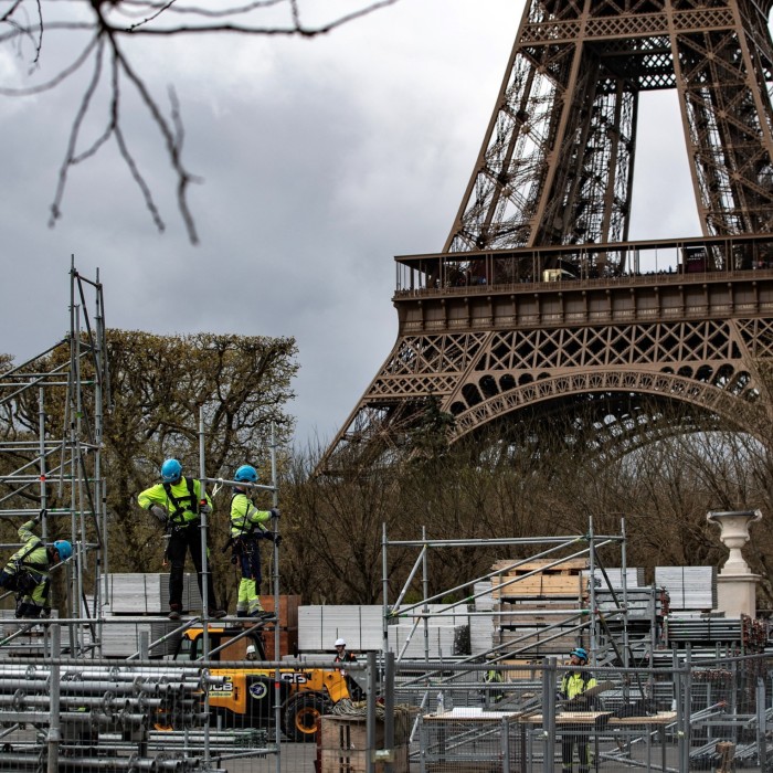 Workers build the Eiffel Tower Stadium