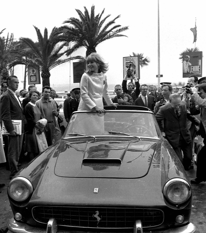 Monica Vitti on a Ferrari car in Canne