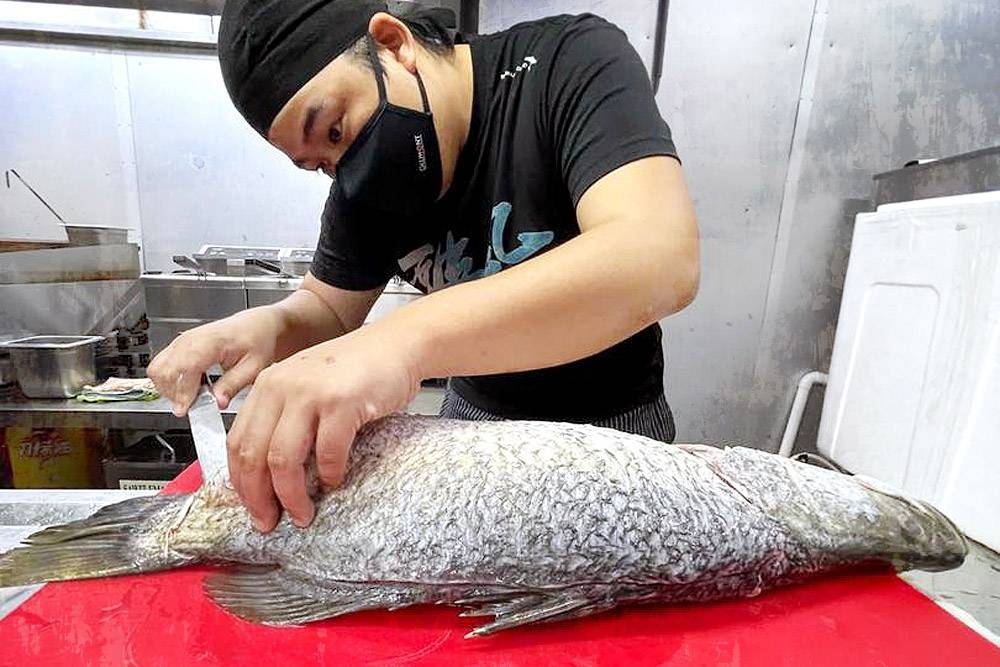 Preparing fish in the kitchen.