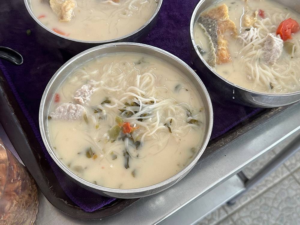 The basic bowl of fish noodles for RM12 is served with fried fish head and 'yee wat'.