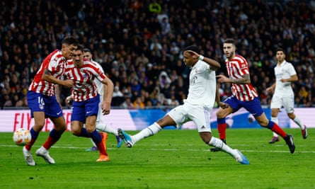 Rodrygo curls in Real Madrid’s equaliser against Atletico Madrid.