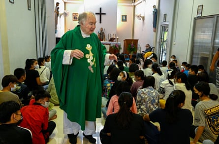 Father Joe conducts a ceremonial mass at Bangkok’s Khlong Toei slum