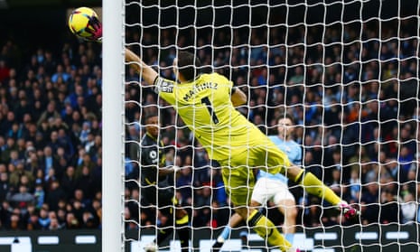 Aston Villa goalkeeper Emiliano Martinez makes a save from Jack Grealish