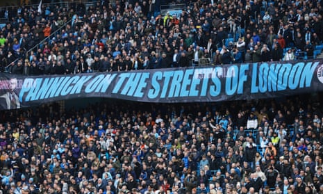 Manchester City fans with a banner inside the stadium before the match