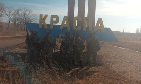 An image released by Yevgeny Prigozhin’s press service is said to show Wagner fighters at the entrance to the village of Krasna Hora, near Bakhmut, Ukraine, on 12 February 2023.