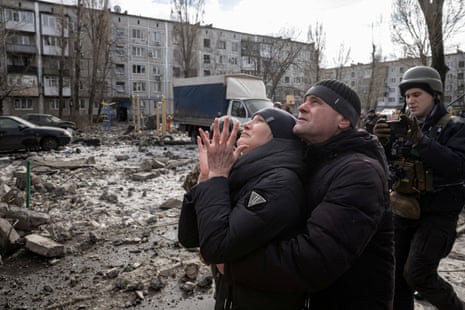 A woman reacts as her brother is rescued after an apartment block was heavily damaged by a missile strike in Pokrovsk, Donetsk region, Ukraine.