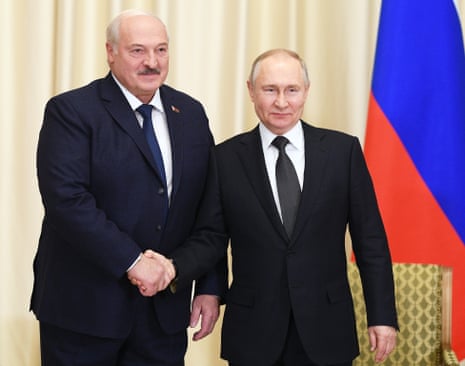 Russian President Vladimir Putin and Belarusian President Alexander Lukashenko shake hands during a meeting at the Novo-Ogaryovo state residence, outside Moscow.
