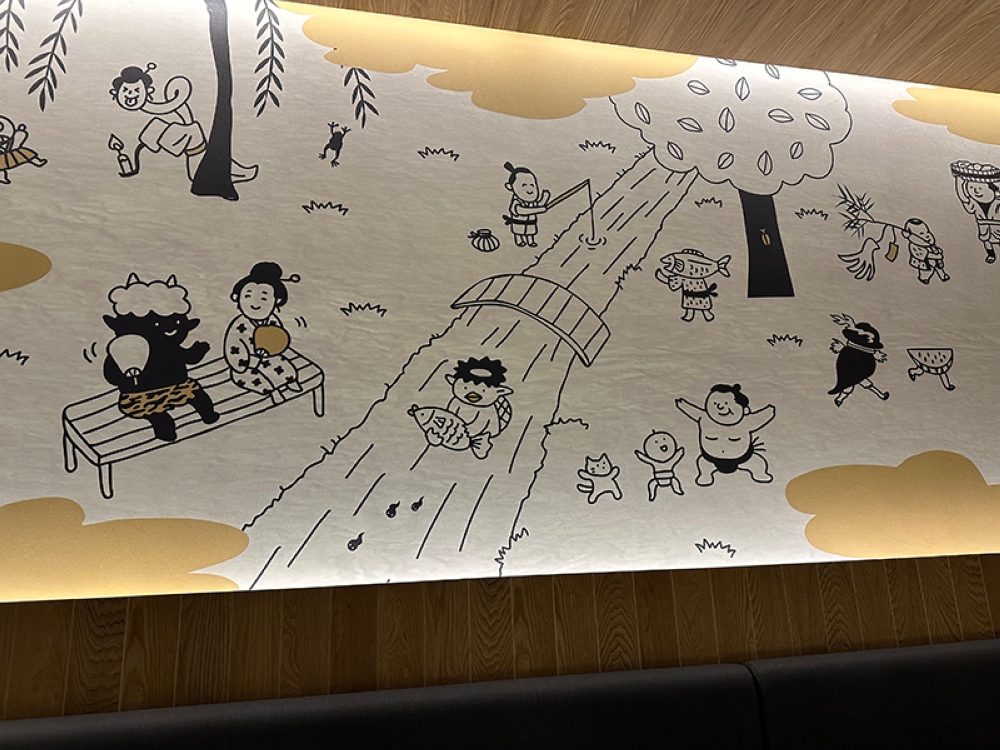 Adorable drawings showing scenes of Japanese day to day activities decorate the walls