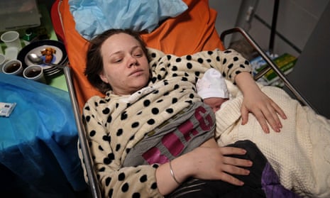 Marianna Vishegirskaya lies in a hospital bed after giving birth to her daughter Veronika, in Mariupol, Ukraine, Friday, 11 March 2022.