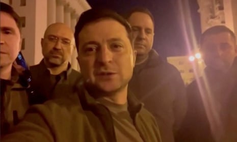 Ukrainian President Volodymyr Zelenskiy speaks alongside other Ukrainian officials in the governmental district of Kyiv, confirming that he is still in the capital, in Kyiv, Ukraine 25 February 2022 in this screengrab obtained from a handout video.