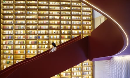 Customers walk down a staircase at a Jinchuang bookstore in Nanjing, in China’s Jiangsu province