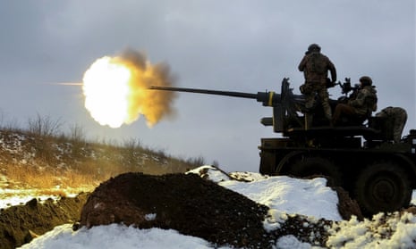 Ukrainian soldiers fire an anti-aircraft gun at a position near Bakhmut.