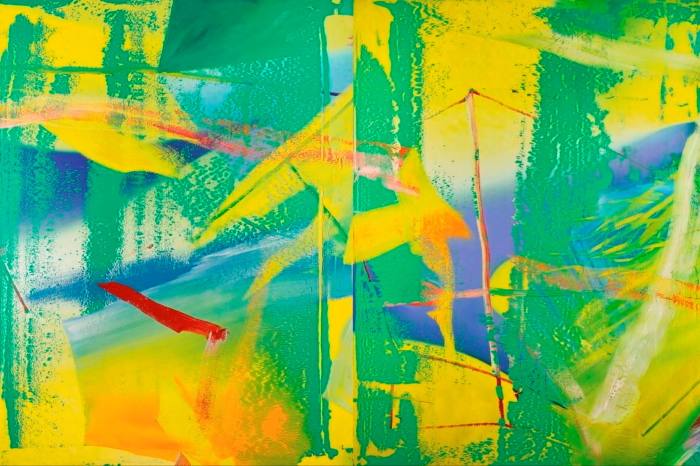 A bright green and yellow squeegee painting