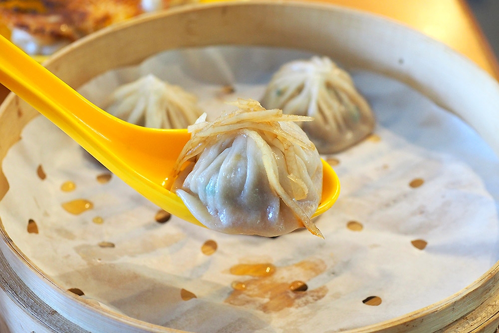 Pair the 'xiao long bao' with ginger and vinegar for a satisfying bite.