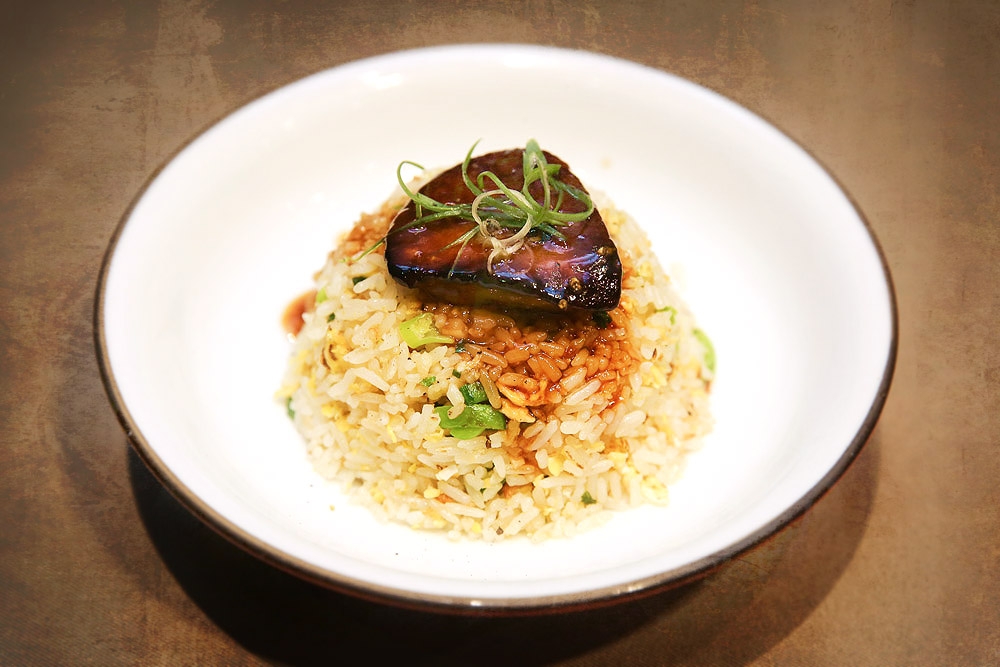 East meets West with this garlic fried rice topped with a rich slab of ‘foie gras.’ — Picture by Yusof Mat Isa 