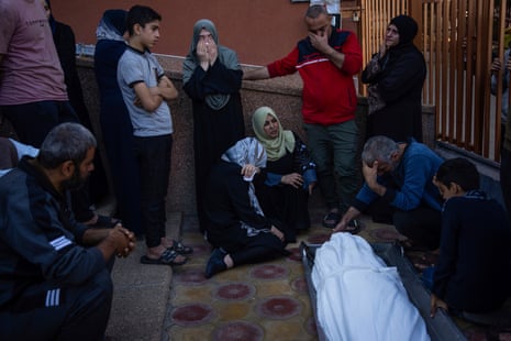Palestinians mourn their relatives killed in the Israeli bombardment of the Gaza Strip, in the hospital in Khan Younis, on 3 December 2023.