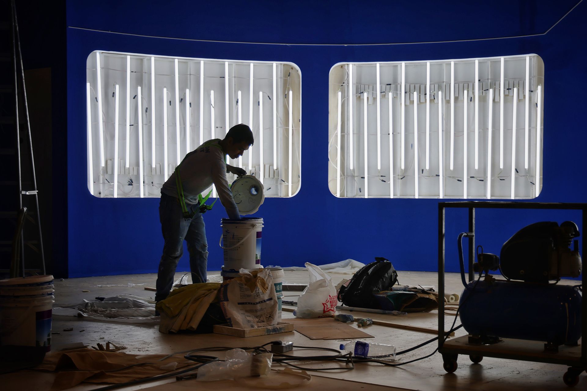 A worker setting up the Comac booth at the Changi Exhibition Centre on Feb 15.  ST PHOTO: JASON QUAH