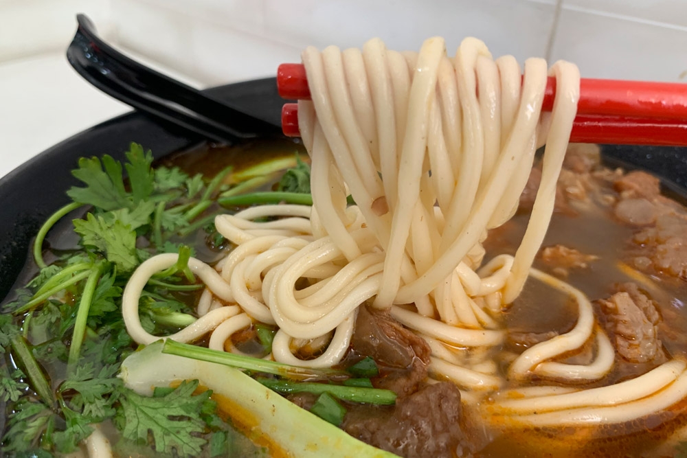 The homemade noodles are chewier and more 'QQ' due to pulling them by hand.