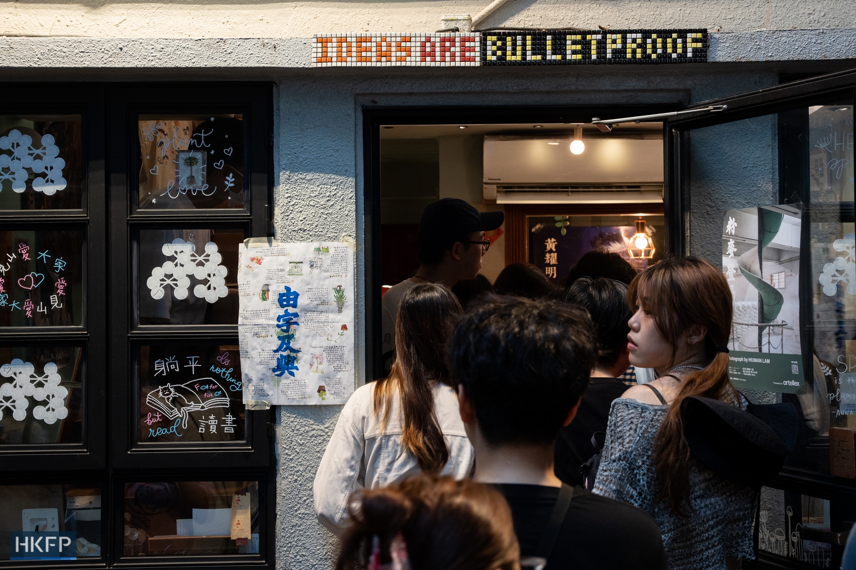 Hundreds pay tribute to Hong Kong independent bookstore Mount Zero on March, 31, 2024, the last day of its business. Above the store's front door is a mosaic sign that read: "Ideas are bulletproof". Photo: Kyle Lam/HKFP.