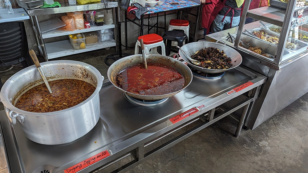 Don't be afraid to ask someone, as the labels don't always correspond to the pots: for example, that is a pot of 'gulai daging kawah' labelled as 'gulai kambing', which is actually only available on Sundays and public holidays.
