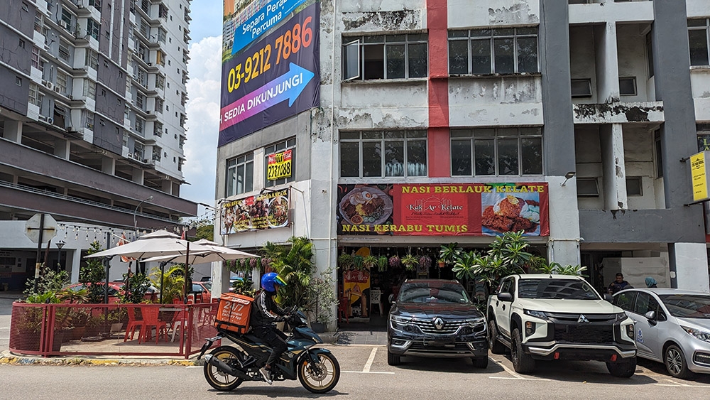 Look for the shop's signboard that's plastered with pictures of food.